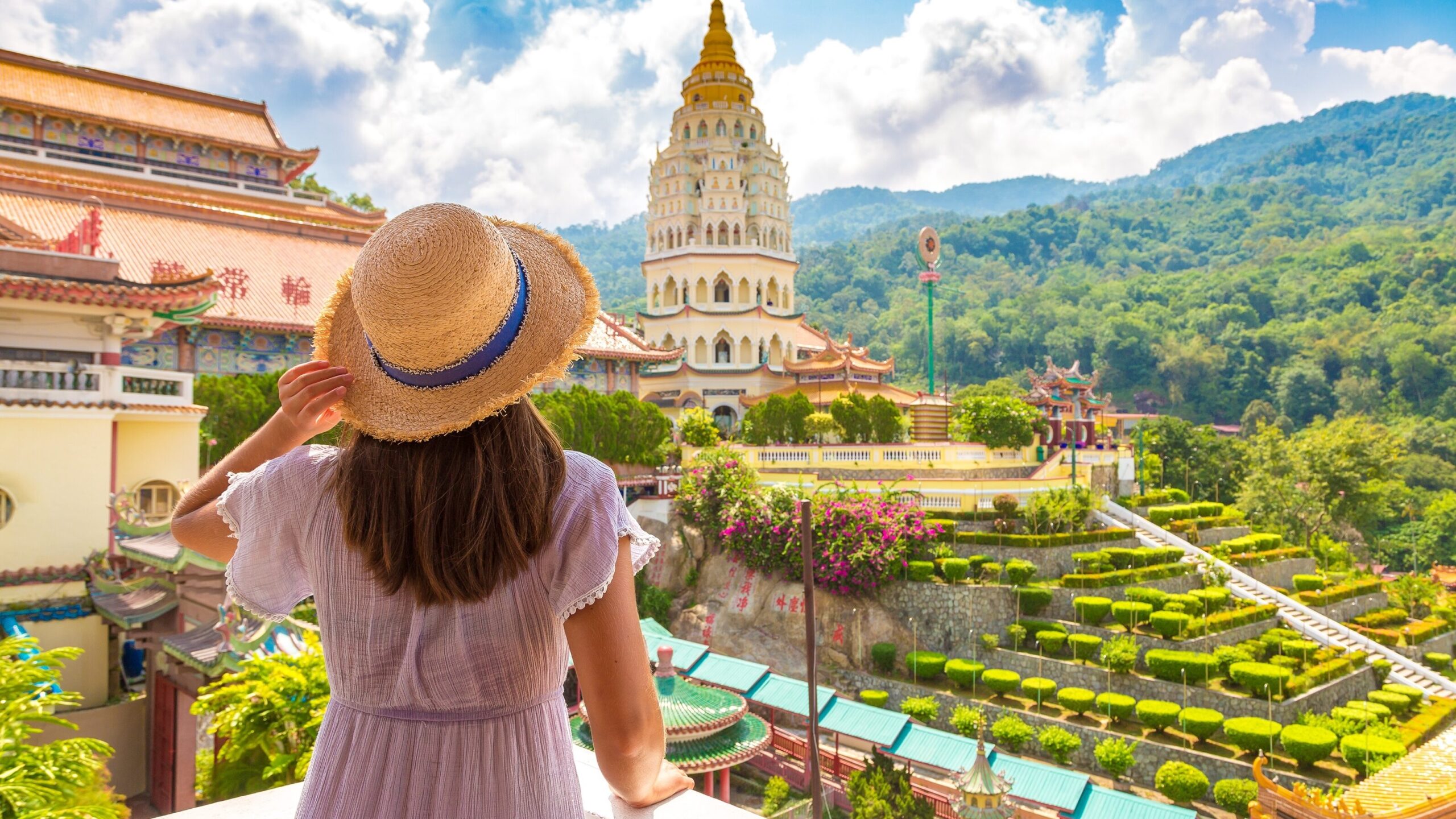 A female tourist looking at the beautiful view of beautiful mountains at Kuala Lumpur